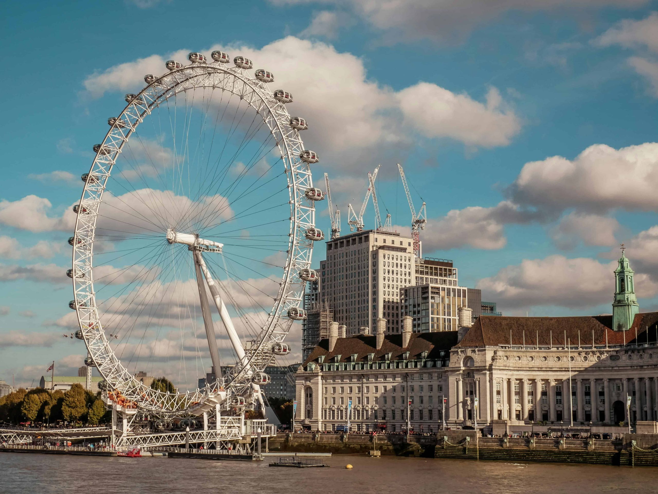 London South Bank waterside with the big London Eye and blue sky.