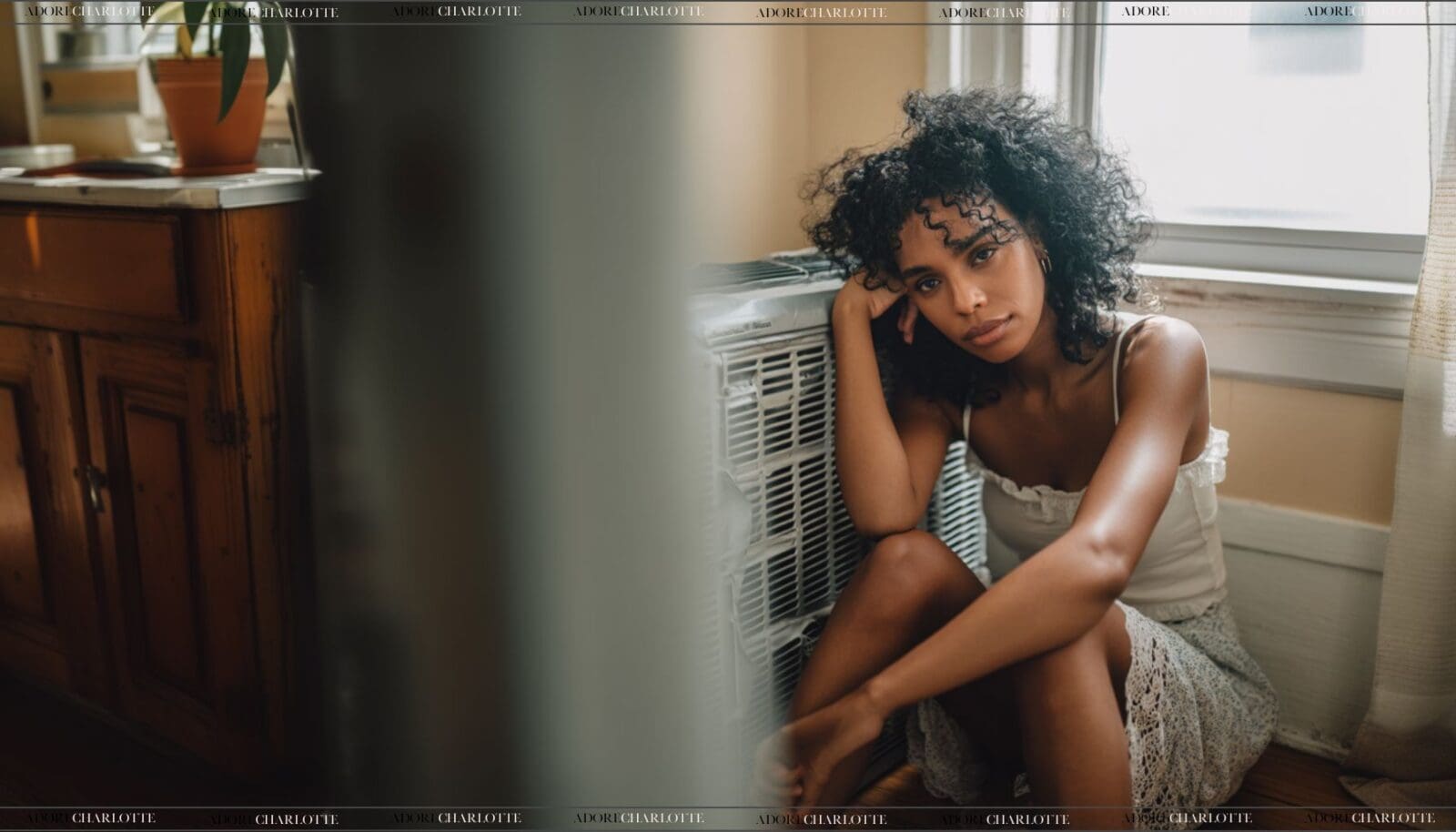 Air Conditioning System Faults woman sitting by a broken unit